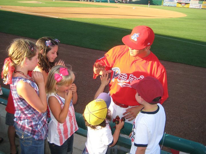 Smyth signing autographs as a pro-ball player