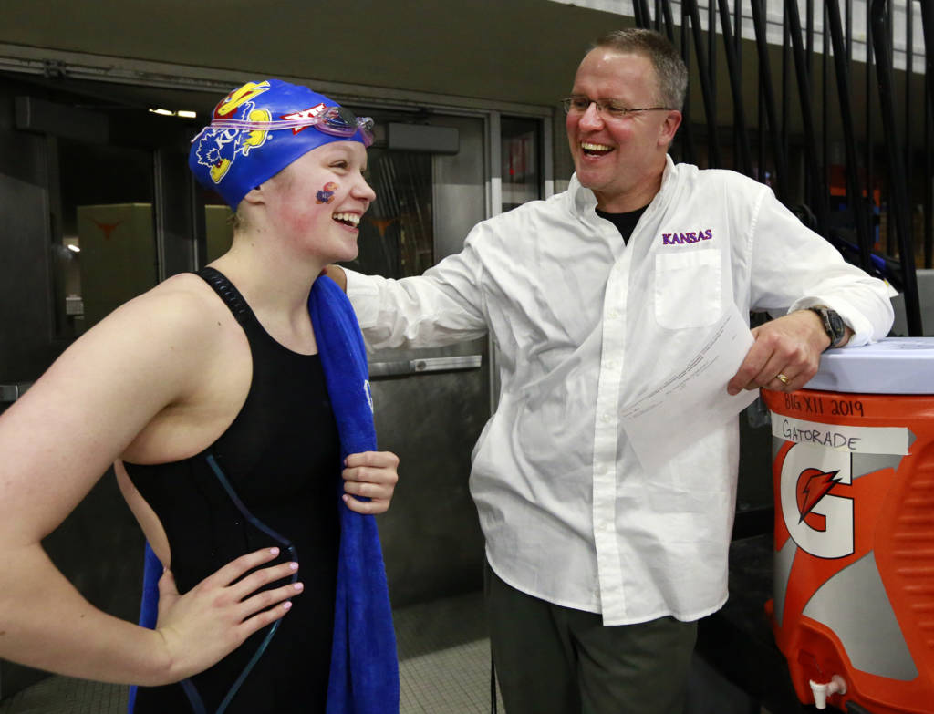 Head coach Clark Campbell congratulated Big 12 200-yard breaststroke champion Kate Steward.