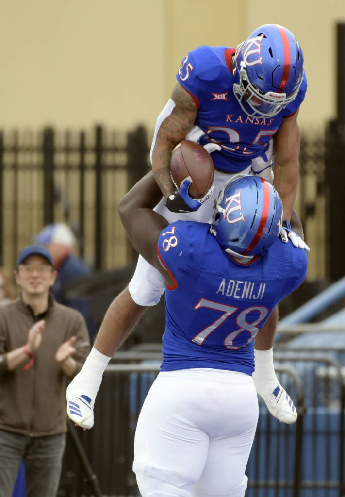 Williams was lifted up by Hakeem Adeniji after scoring a touchdown.